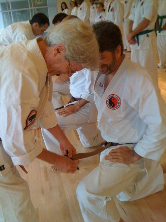 Luis Caamano receiving rank promotion from Master Allen Hoss April 24th, 2010